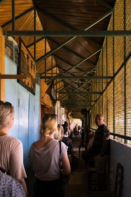 A group sprinting through a narrow corridor, adrenaline visible in their expressions.