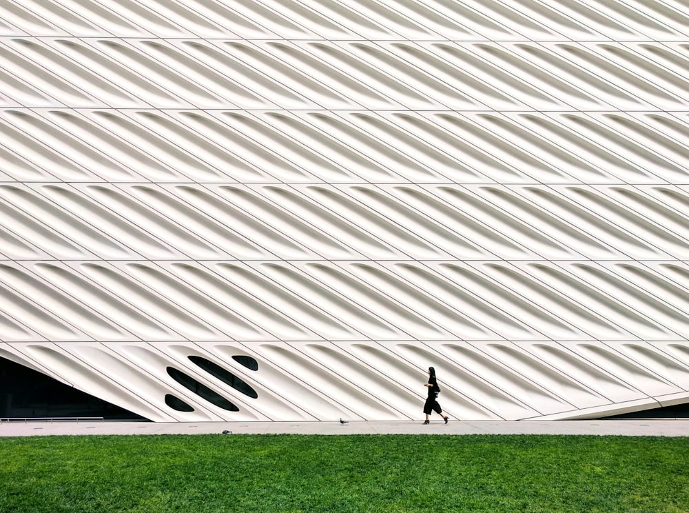 person walking on concrete pathway