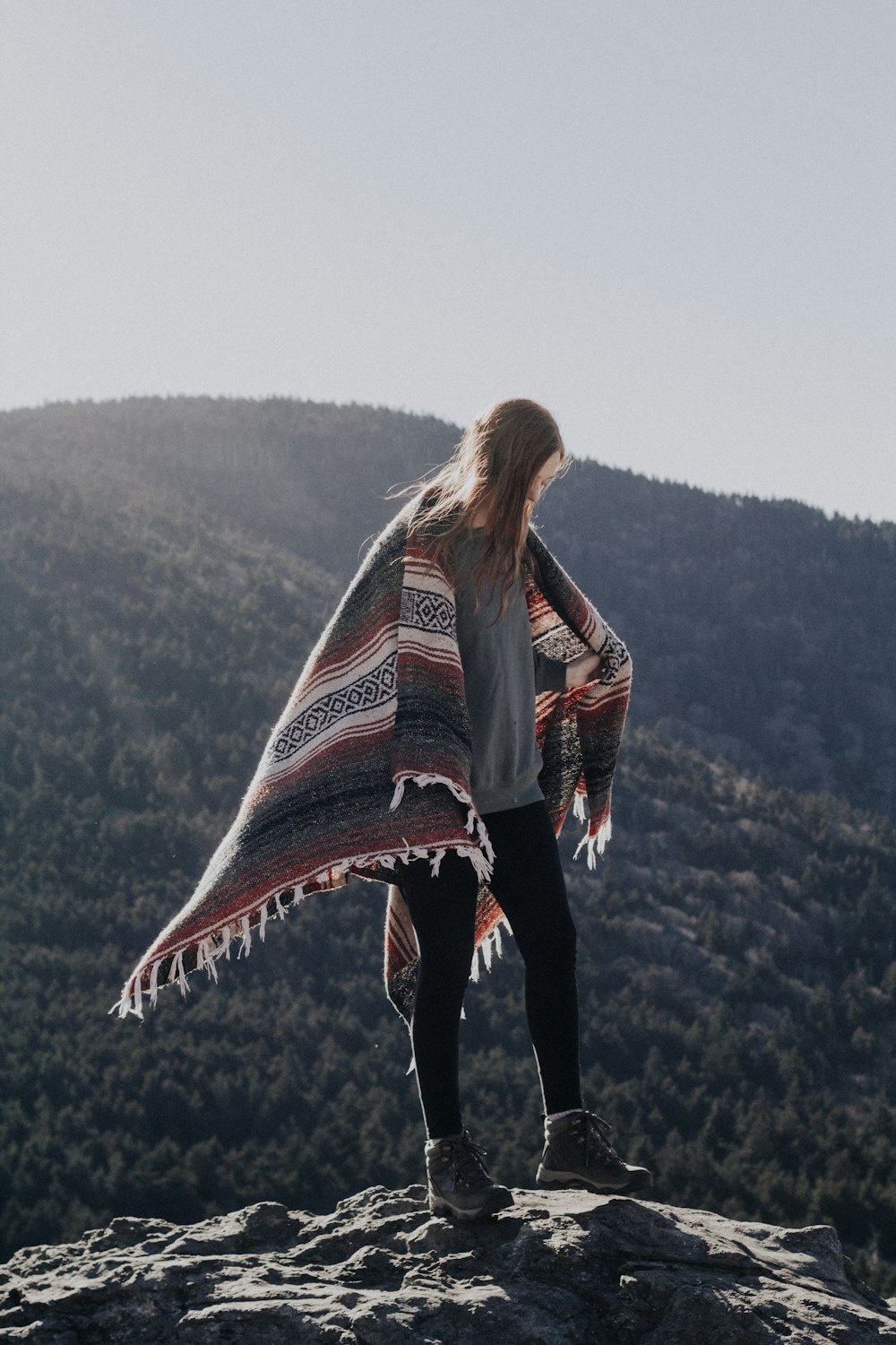 woman standing on mountain