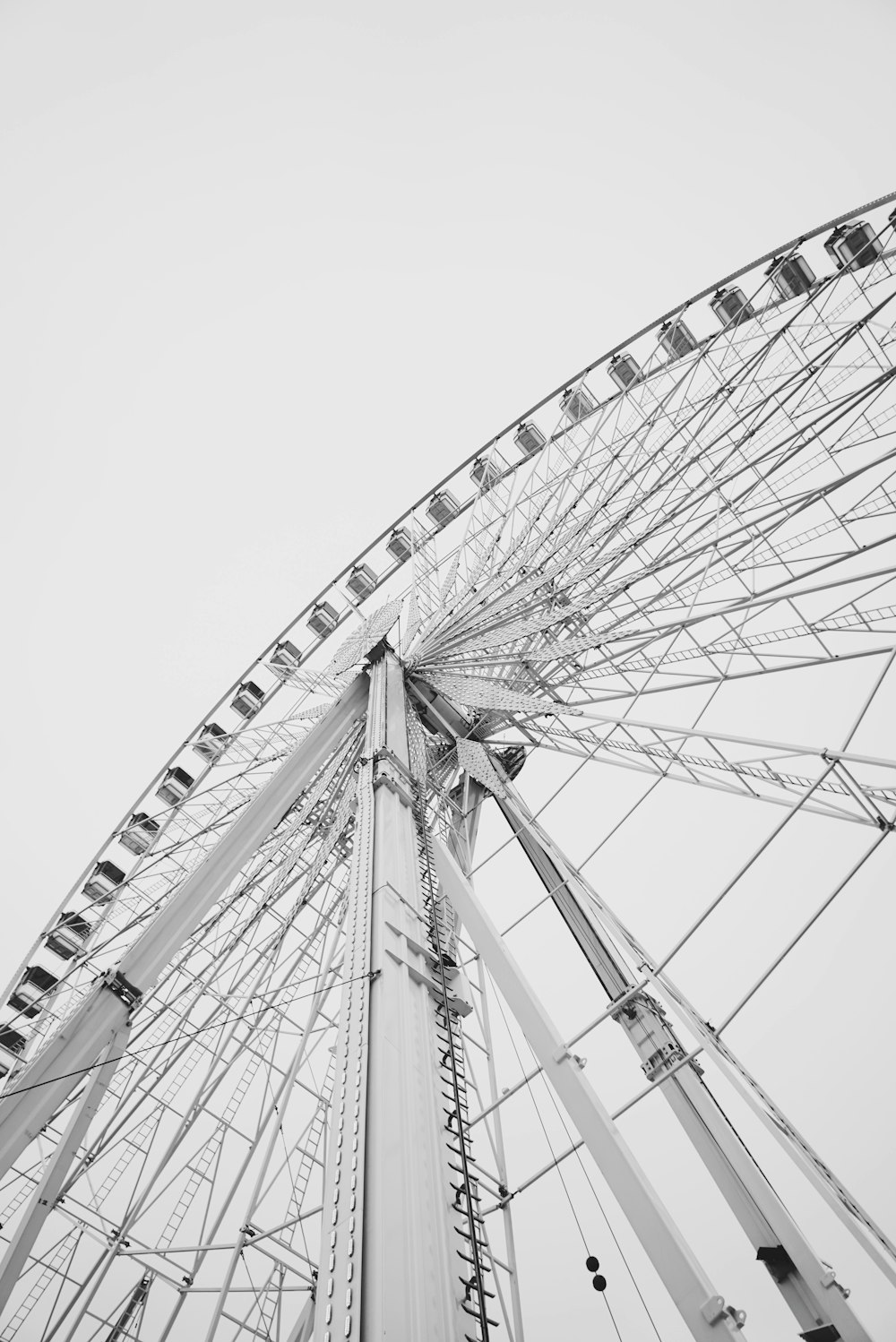 white ferris wheel in grayscale photography