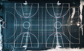 green and white basketball court in top view photography