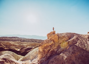 person standing on top of mountain