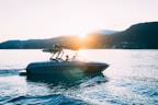 photo of people riding power boat