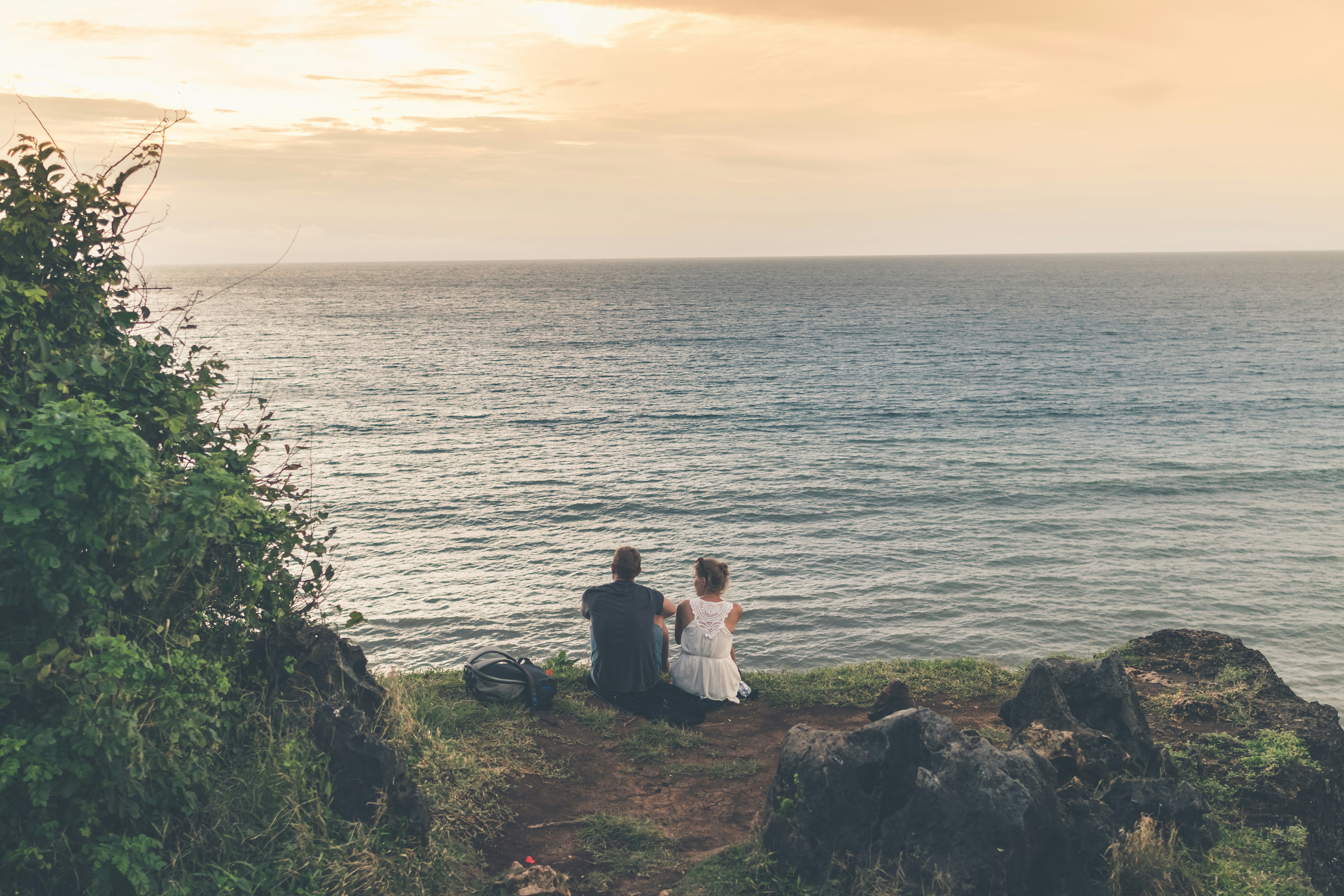 A couple relaxing at the water body