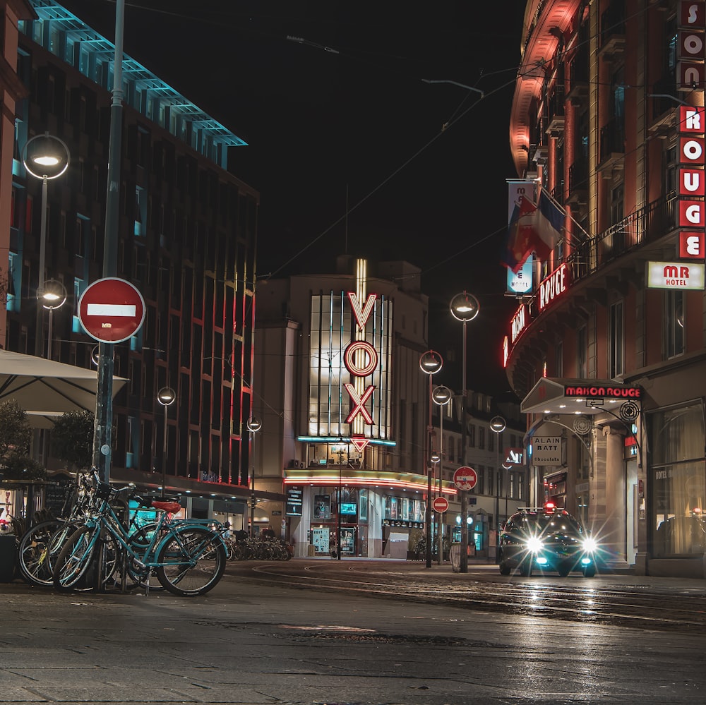 street during night time with bicycle parked in side roads