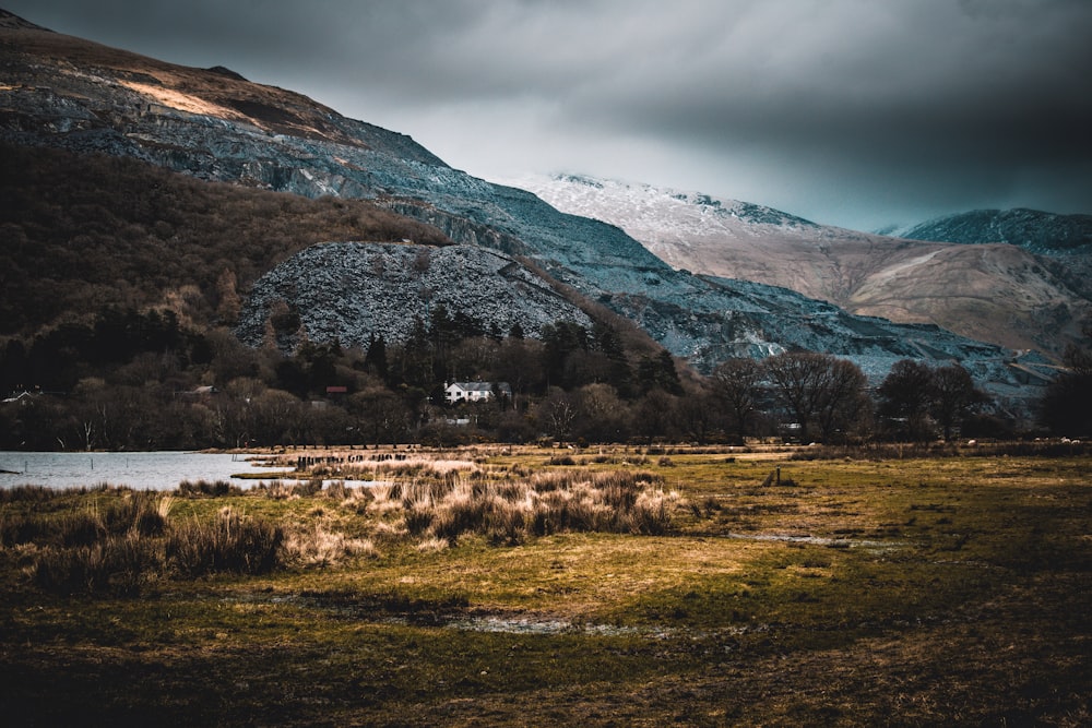 landscape photography of green grass across mountain