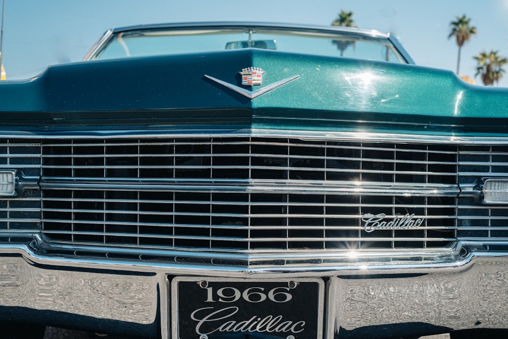 green and gray Cadillac car at daytime