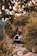 woman sitting on mountain cliff
