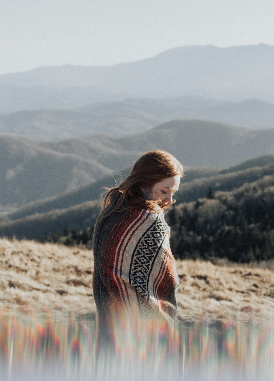 woman sitting on grass field