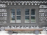 Elegant wooden wall art with geometric patterns hanging in a modern Tunisian home.
