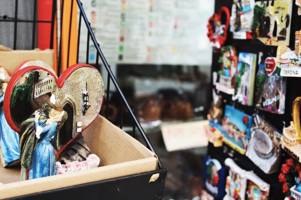 couple kissing figurine on top of rack near display of product packs