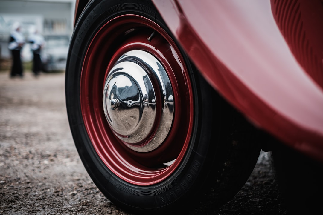 silver and red car wheel with tire