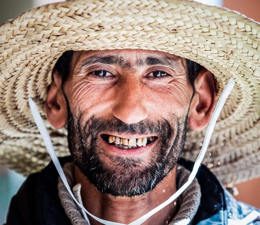 photo of man wearing brown sun hat