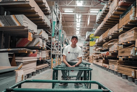 man sitting on gray trolley