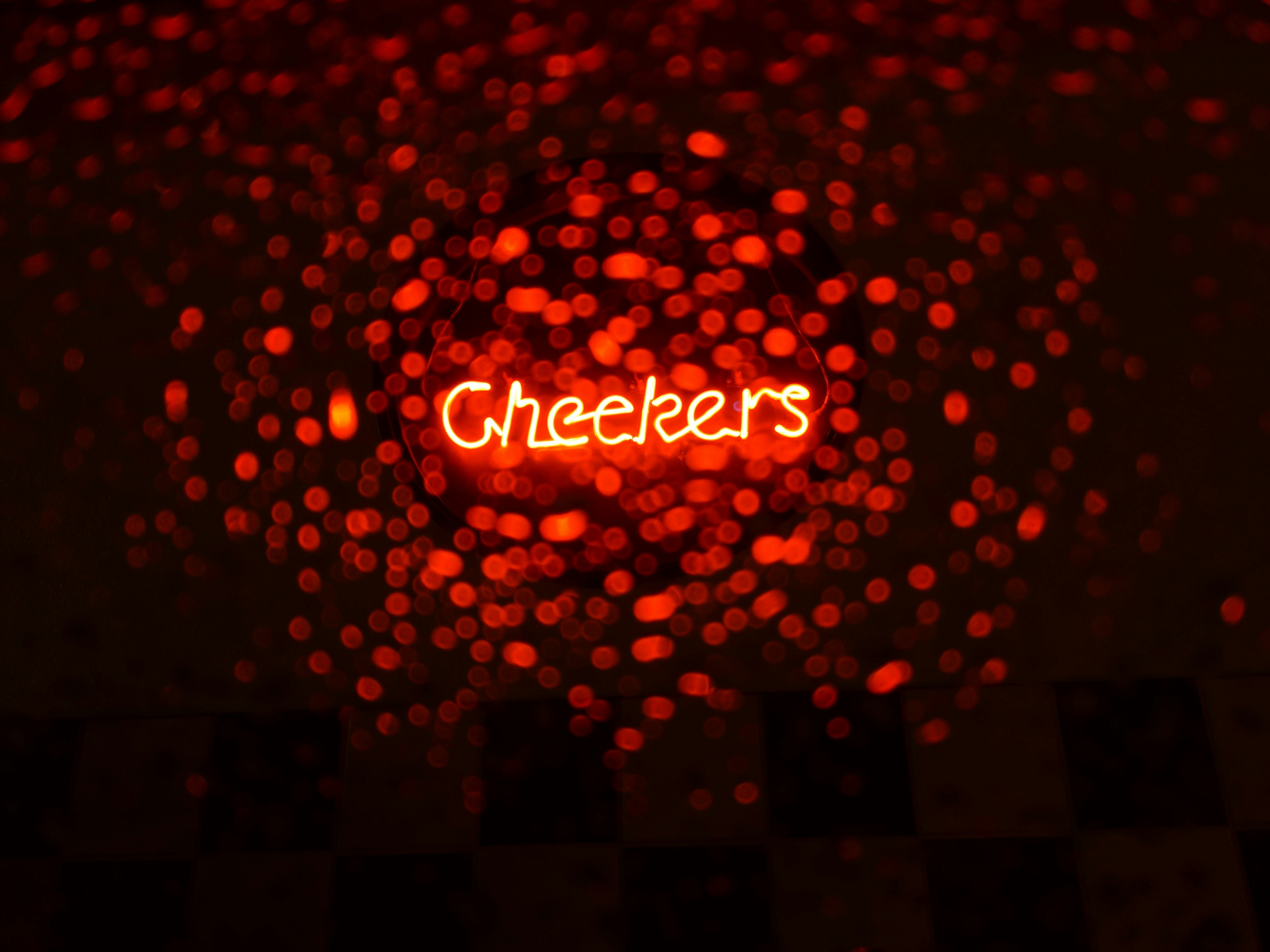 I was on my way home from work during a late rainy evening. As I passed through Fredericksburg I began to crave Checkers fries. I pulled into the drive through and saw this sign. Taking a picture through the glass attempting both focusing on the letters and the rain. I settled on focusing on the letters as it seemed to burn through everything else.