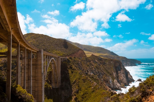 photo of bridge near body of water in Bixby Creek Arch Bridge United States