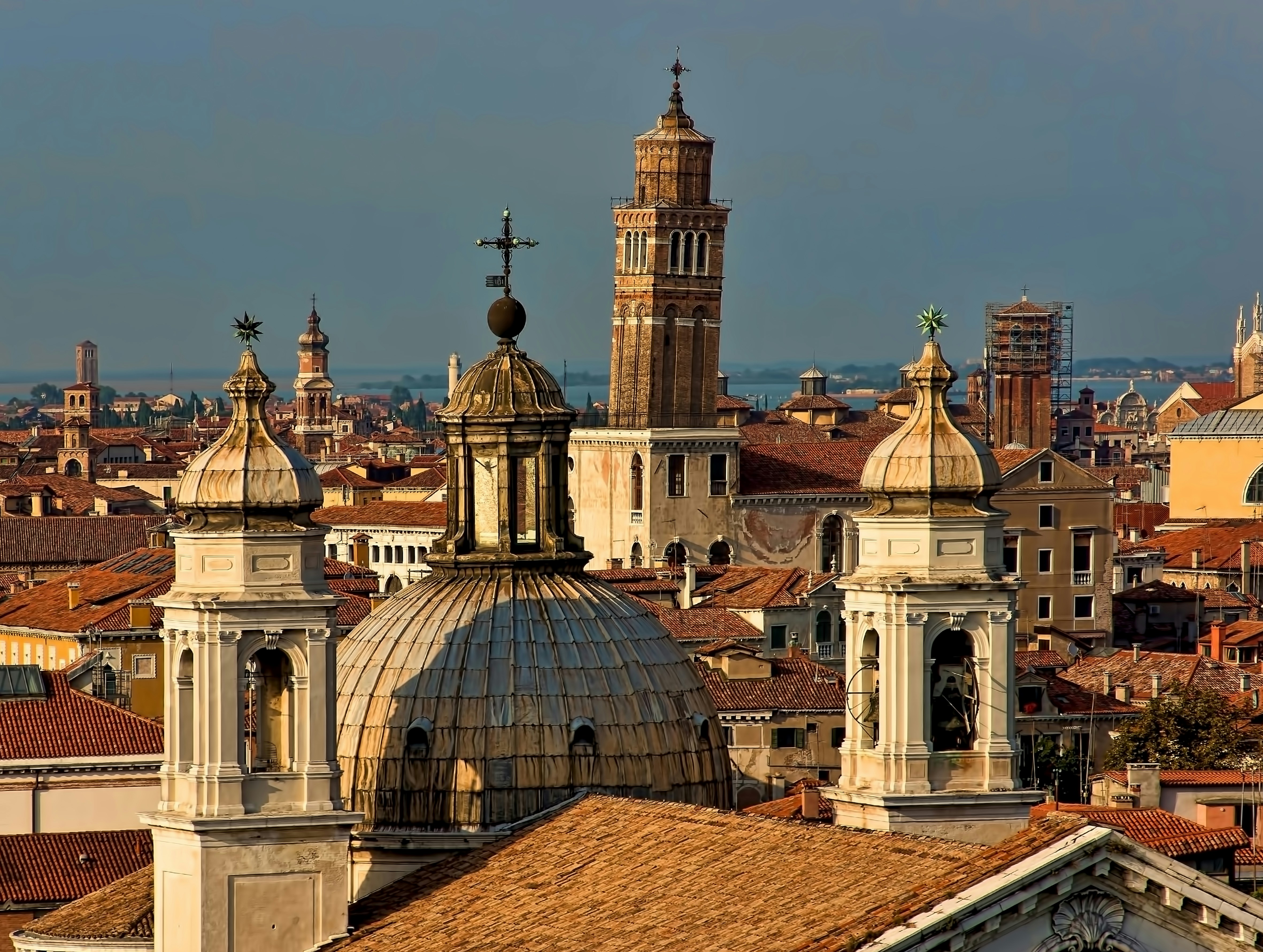 brown tiled roof cathedrals in the city, Leaning tower of  Venice