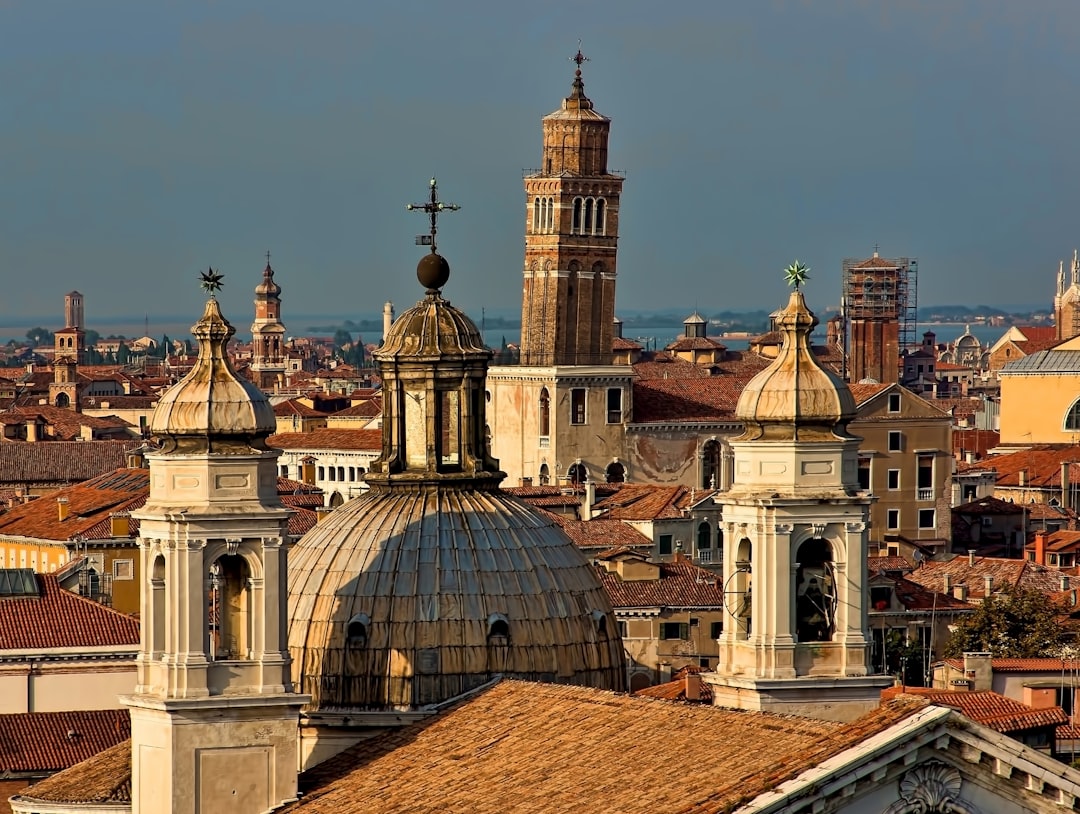 brown tiled roof cathedrals in the city, Leaning tower of Venice