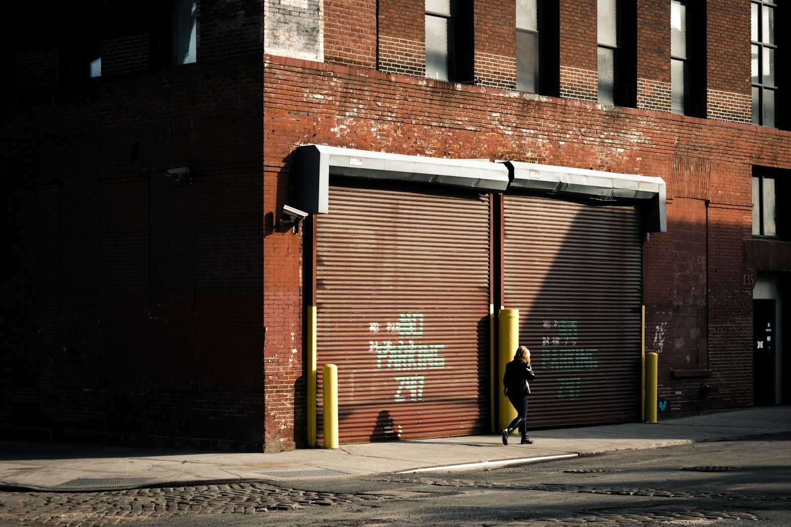 Sigma 18-50mm f/2.8 Macro sample photo. Person walking on alley photography