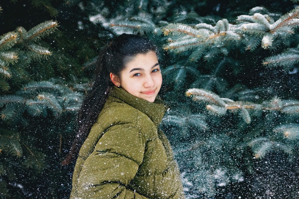 woman wearing jacket beside the tre