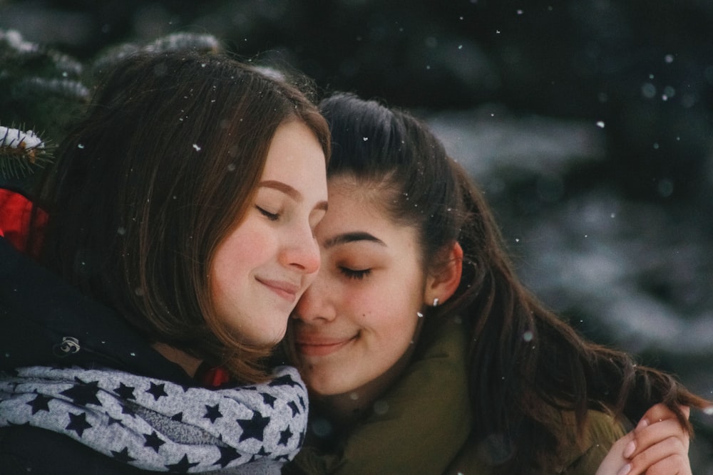 women hugging each other