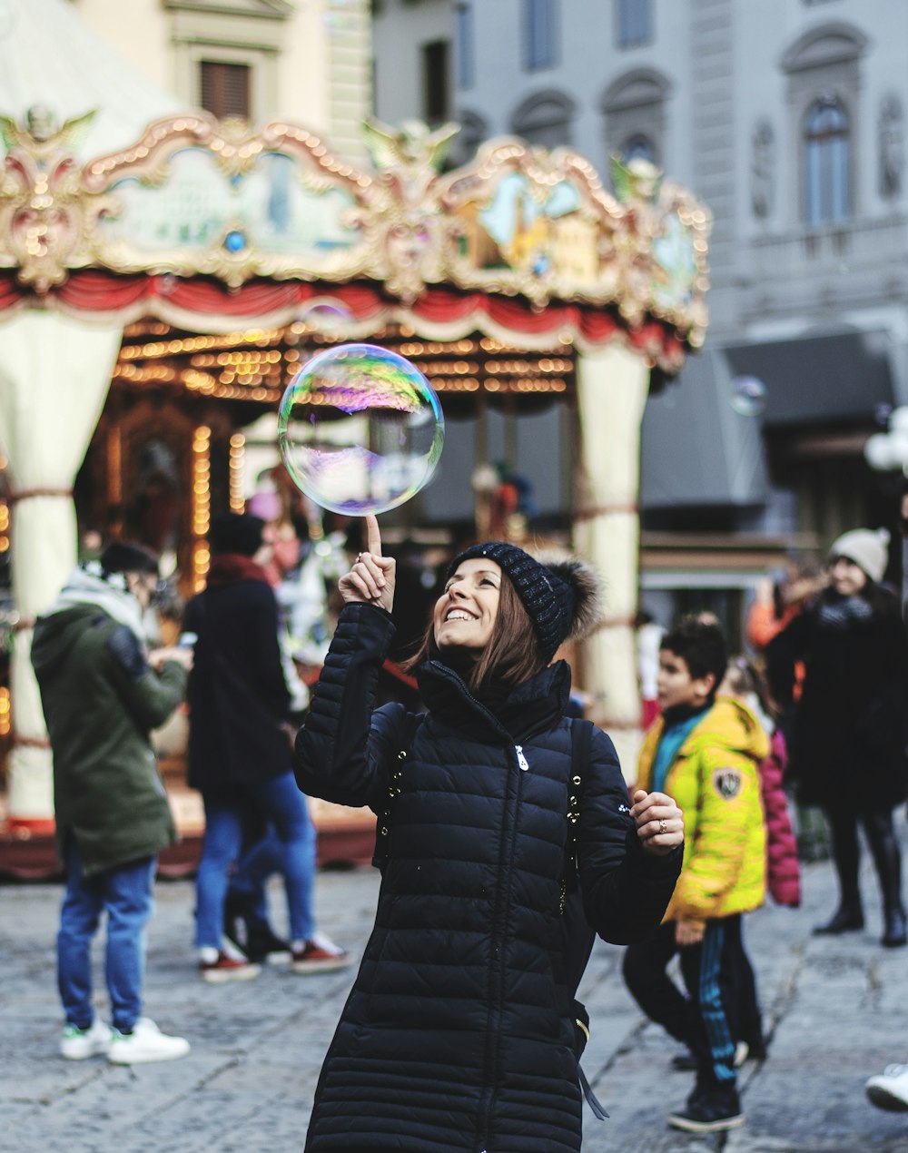 woman touching bubble on mid air