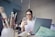 woman in white shirt using smartphone