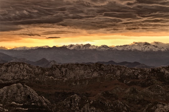 mountain under cloudy sky during sunset in Mirador del Sueve Spain