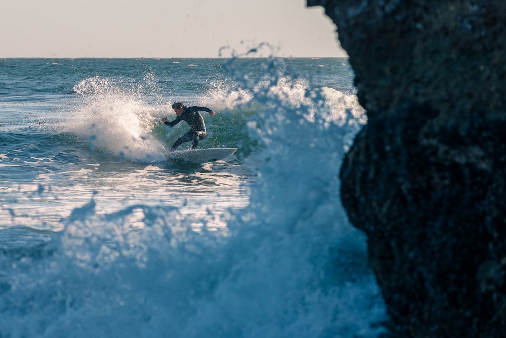 photography of surfboarding man