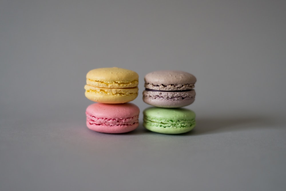 yellow, pink, brown, and green macaroons
