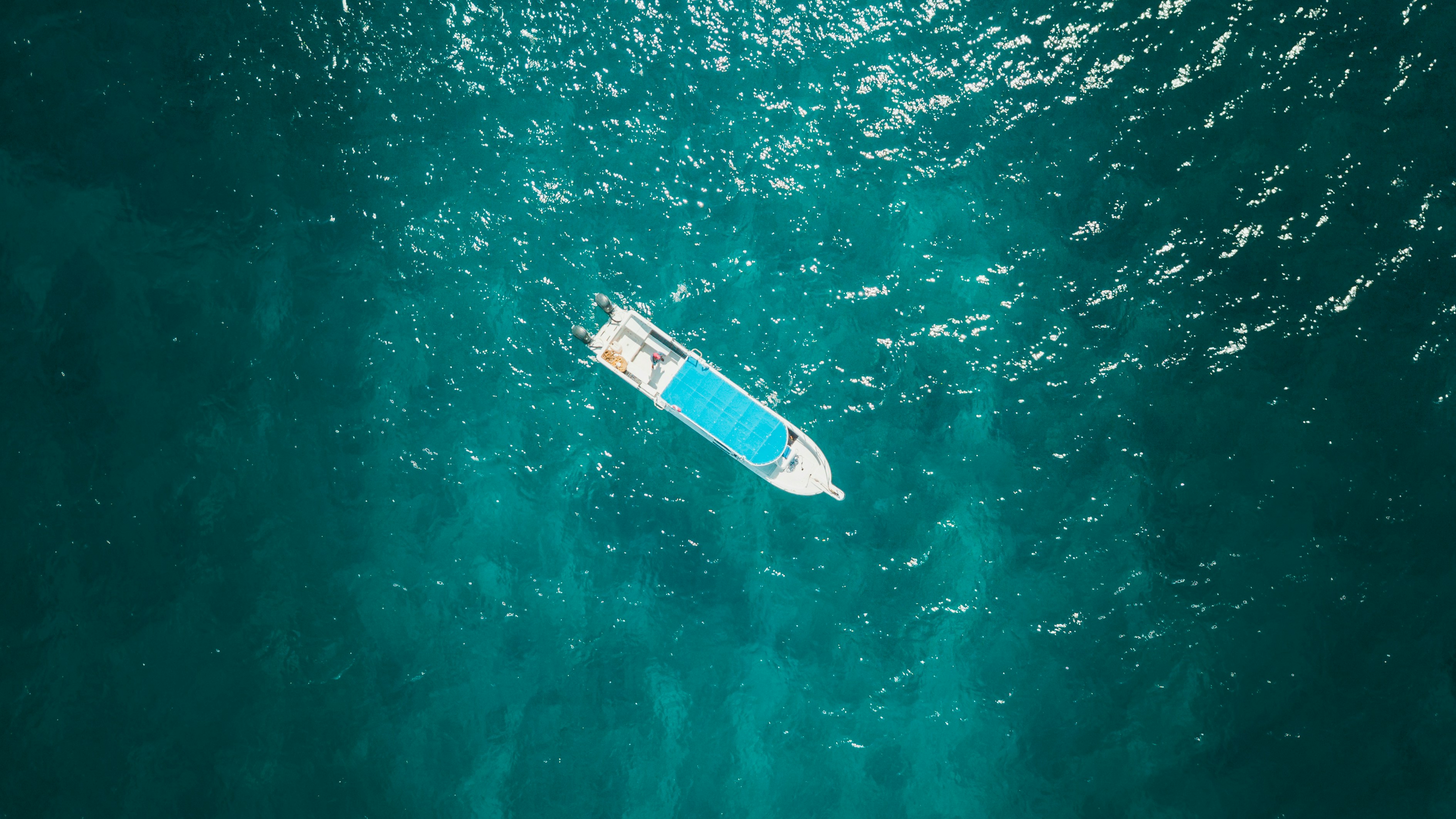 aerial view photography of boat, Spent a much needed weekend in Tulum for a family wedding. I was blessed by the beauty of their ceremony in a location that is nothing short of breathtaking. Recently school has really been getting the best of me. I’m not one to slack or live in apathy, but there is a notable struggle to continue with what seems to be a mundane existence of wasting effort on my weaknesses rather than building my strengths. I am appreciative that this tropical destination has allowed me to escape for a short while. It’s not sustainable to run a sprint when you’re in the middle of a marathon we call life.