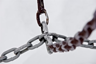 selective focus photograph of gray metal chains