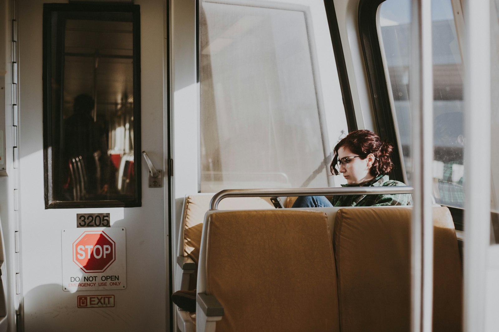 Canon EOS 5D Mark III + Canon EF 50mm F1.8 II sample photo. Woman sitting in train photography