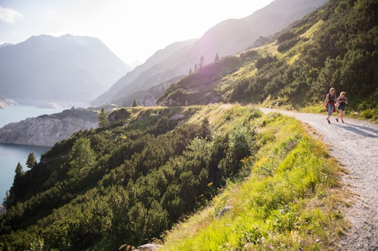 road beside body of water in Kölnbreinspeicher Austria