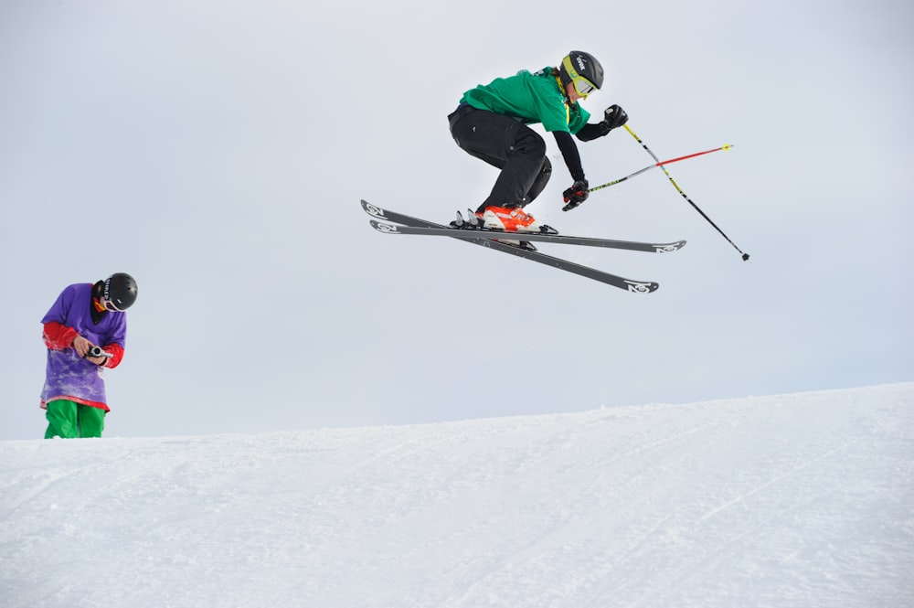 man riding snow skis