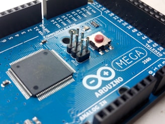 blue and black Arduino Mega circuit board