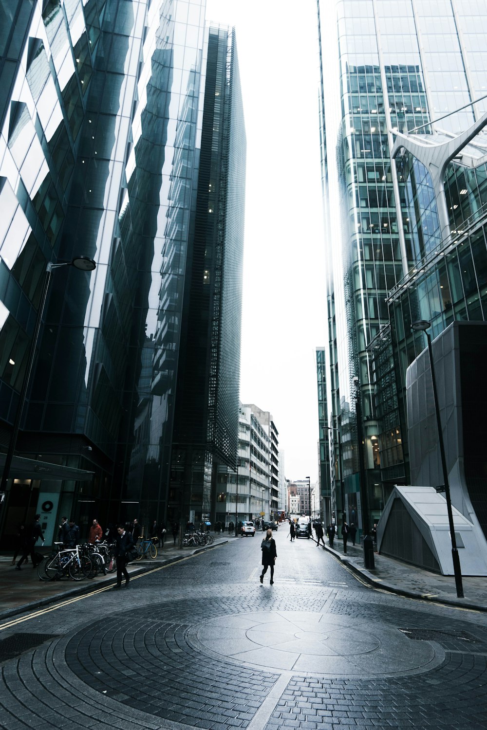 person standing on road near building