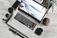 A stylish workspace featuring a premium laptop surrounded by elegant accessories