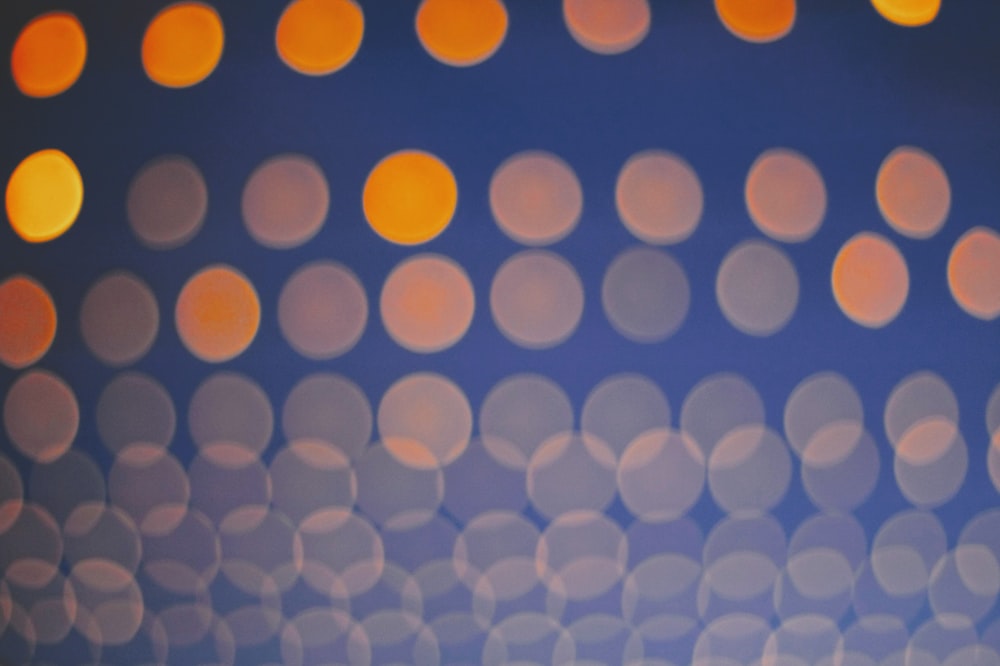 a blurry photo of orange and blue circles