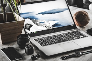 A serene workspace with a laptop and wellness items.