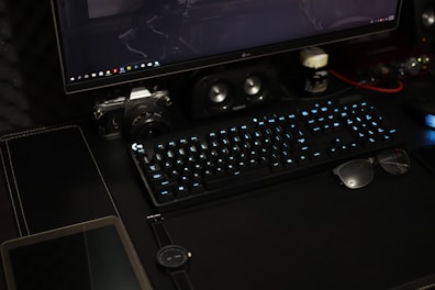 black flat screen computer monitor with keyboard