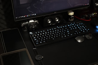 black flat screen computer monitor with keyboard