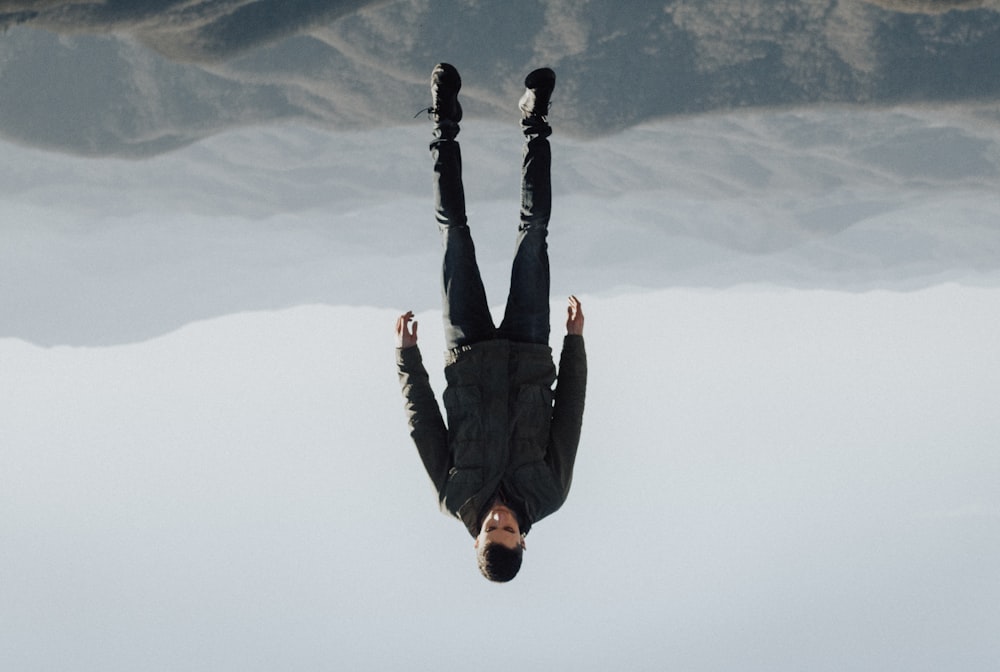 man floating above mountain