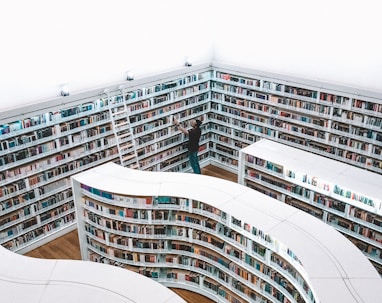 man looking book inside library