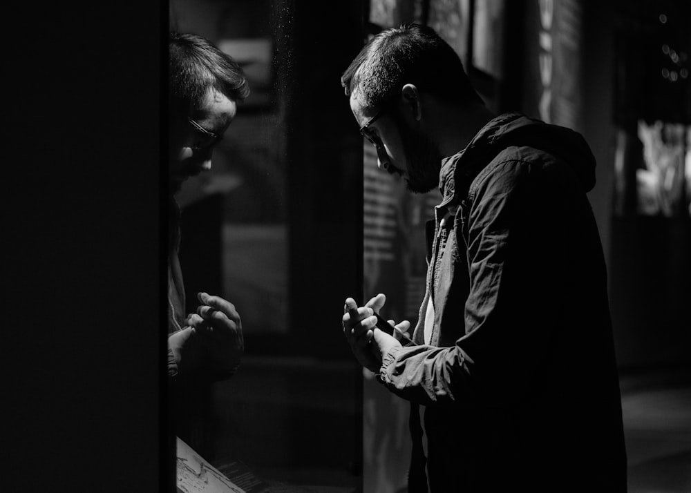 man in front of mirror