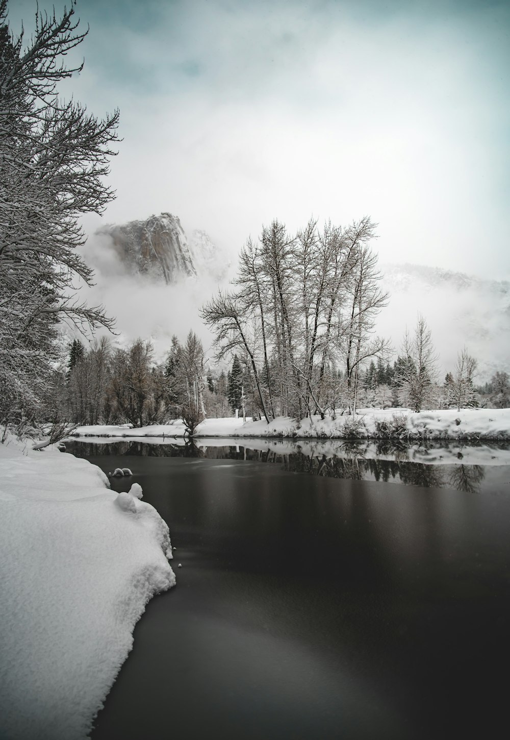 photo of river near snow field