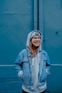 woman in blue jacket wearing jacket and beanie