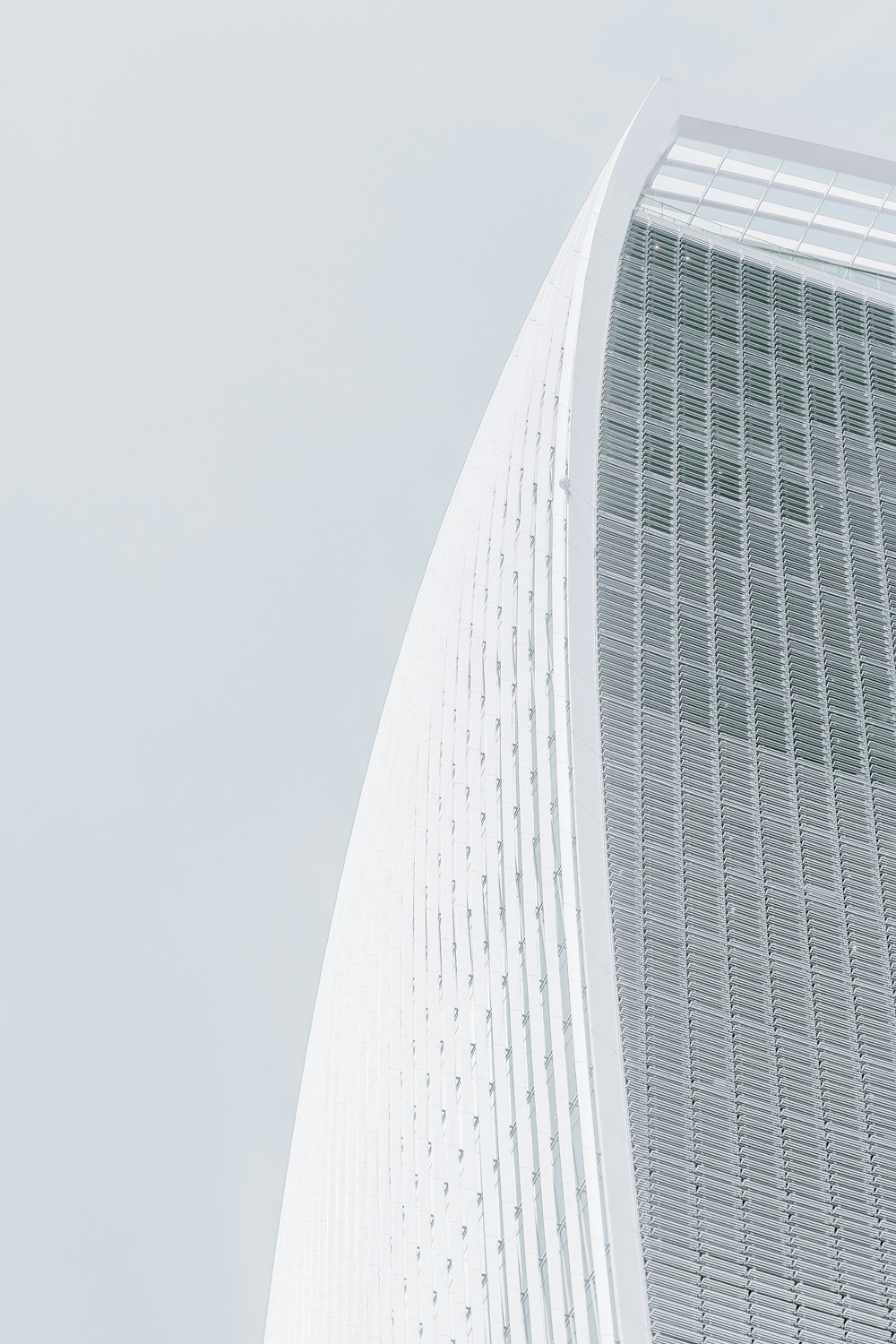 white concrete multi-storey skyscraper at daytime