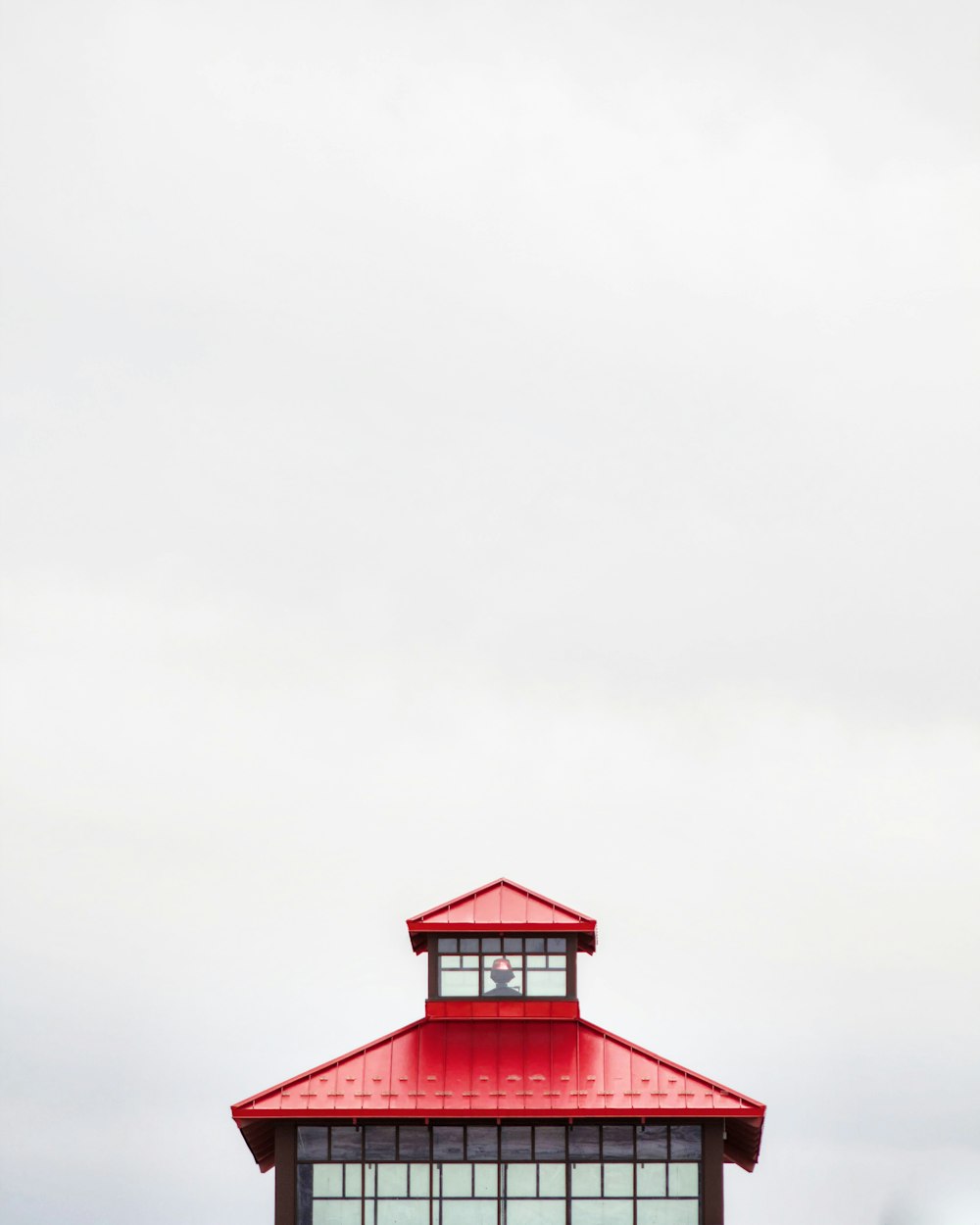 closeup photo of red and black pagoda on white background