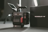 close-up photography of Red Scarlet-W camera with box